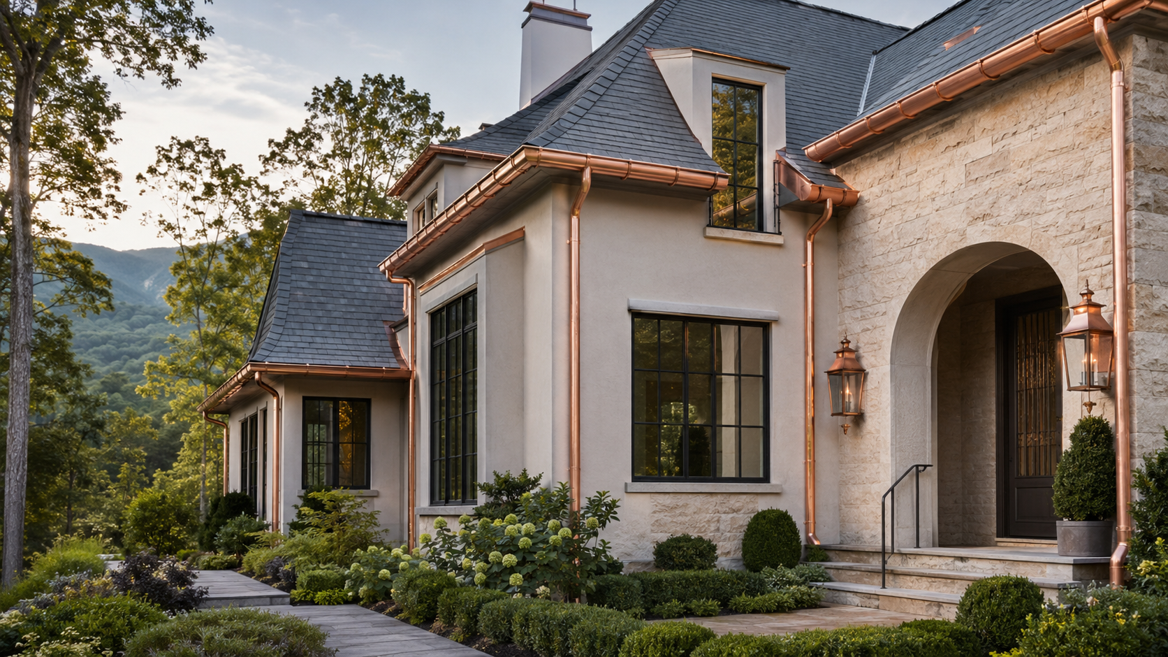 Luxury cream stone and stucco home with genuine copper gutters and round downspouts